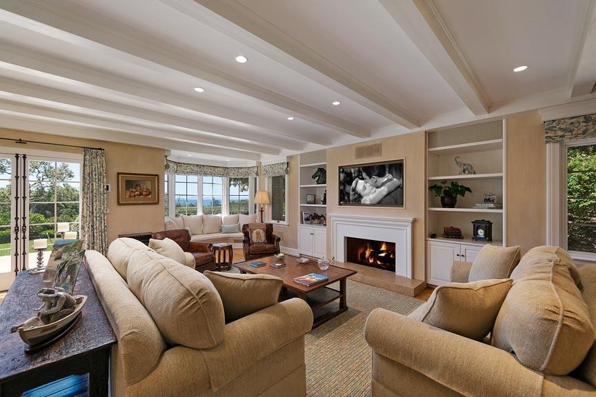 1565 East Valley Road Montecito, CA 93108 - Photo 13 of 31 a living room with furniture flat screen tv and a fireplace