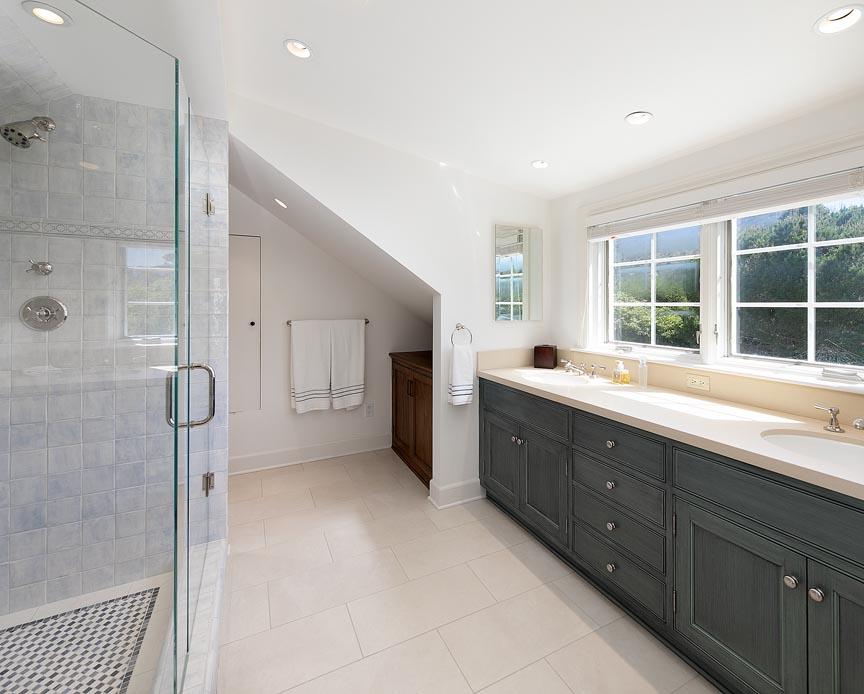 1565 East Valley Road Montecito, CA 93108 - Photo 18 of 31 a bathroom with a double vanity sink a large mirror and shower
