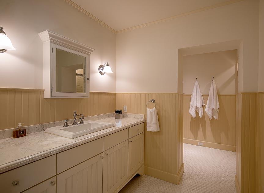1565 East Valley Road Montecito, CA 93108 - Photo 23 of 31 a bathroom with a double vanity sink and mirror