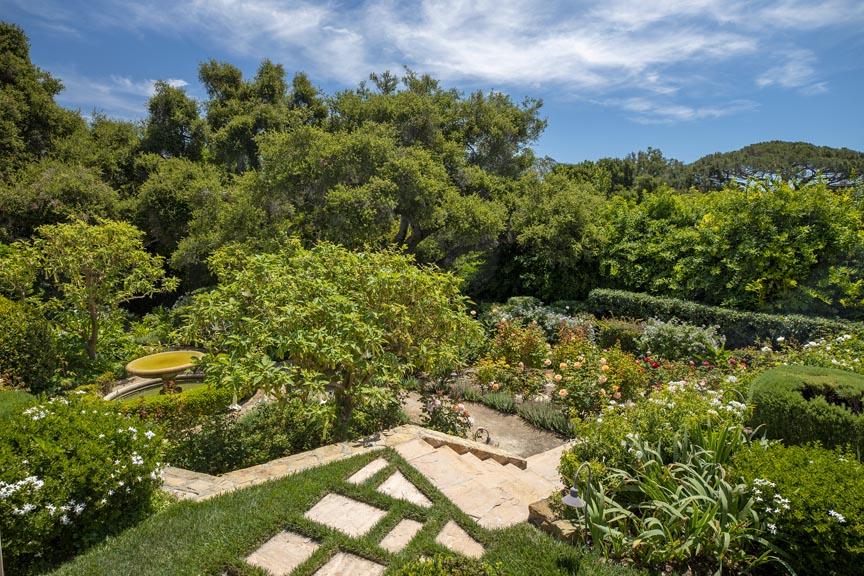 1565 East Valley Road Montecito, CA 93108 - Photo 28 of 31 a view of a garden with a building in the background