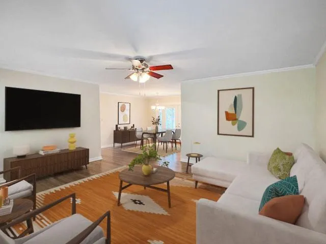 a living room with furniture and a flat screen tv