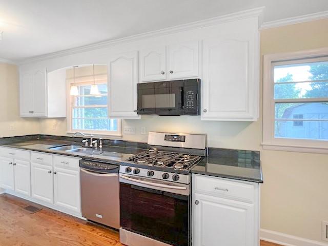 2711 Fairlane Drive Atlanta, GA 30340 - Photo 11 of 31 a kitchen with granite countertop white cabinets and stainless steel appliances