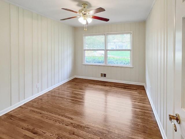 2711 Fairlane Drive Atlanta, GA 30340 - Photo 23 of 31 a view of empty room with wooden floor and fan