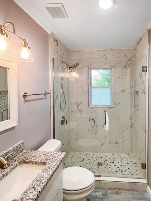 2711 Fairlane Drive Atlanta, GA 30340 - Photo 25 of 31 a bathroom with a granite countertop sink toilet a shower and a mirror