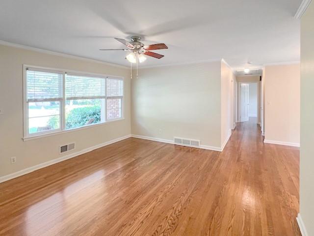 2711 Fairlane Drive Atlanta, GA 30340 - Photo 4 of 31 a view of an empty room with wooden floor and a window