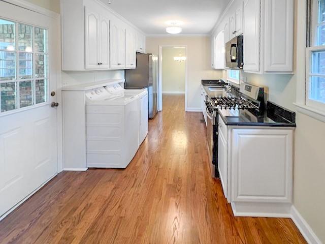 2711 Fairlane Drive Atlanta, GA 30340 - Photo 10 of 31 a kitchen with granite countertop wooden floors and white cabinets