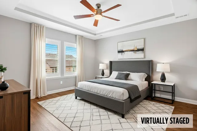 a spacious bedroom with a bed and a window