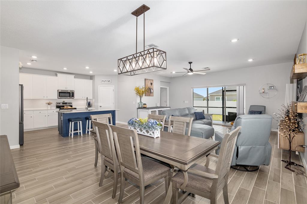 5688 Southwest 92nd Place Ocala, FL 34476 - Photo 16 of 54 a view of a dining room with furniture