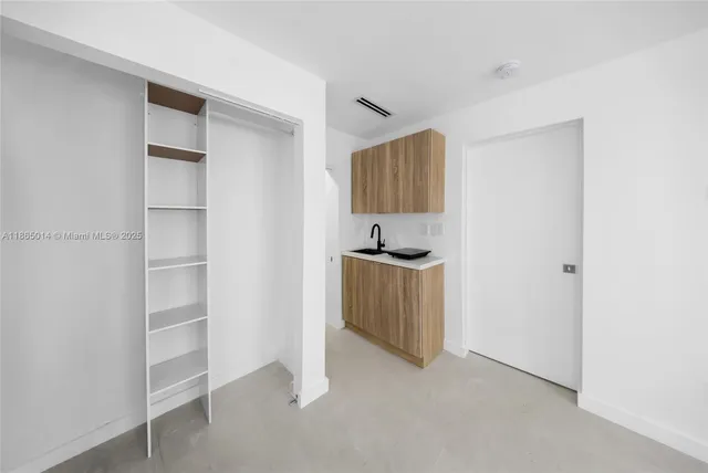 a view of kitchen and utility room