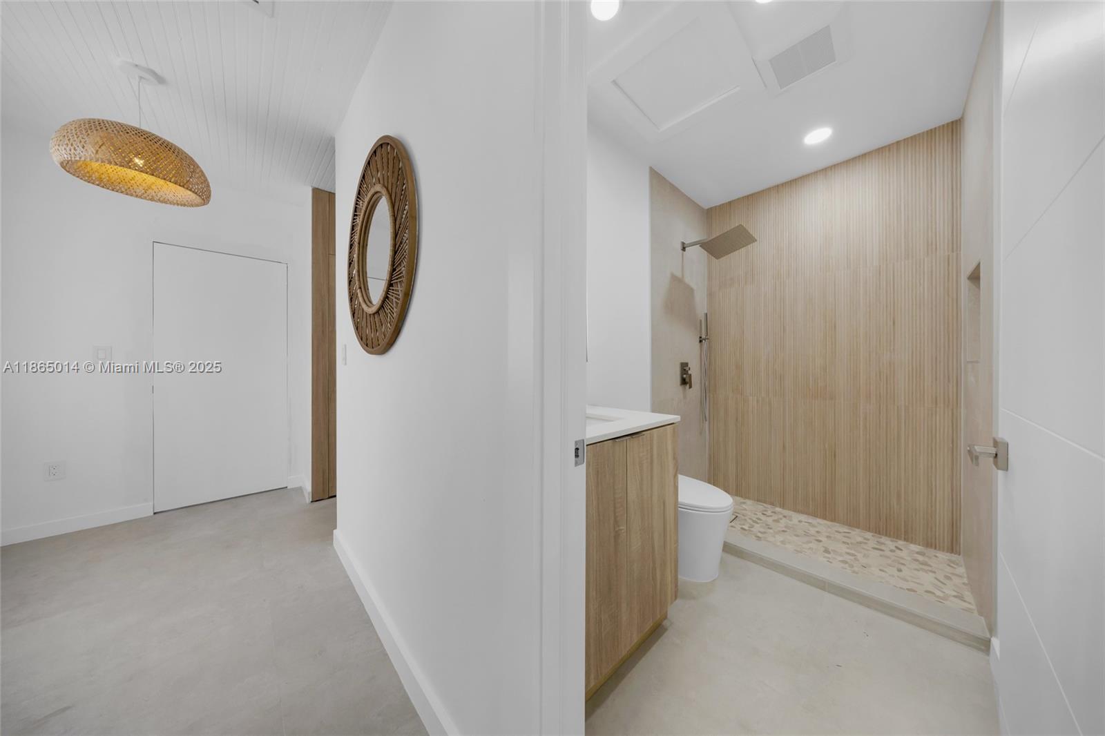 275 Northwest 97th Street Miami, FL 33150 - Photo 16 of 26 a view of a bathroom with a shower and mirror