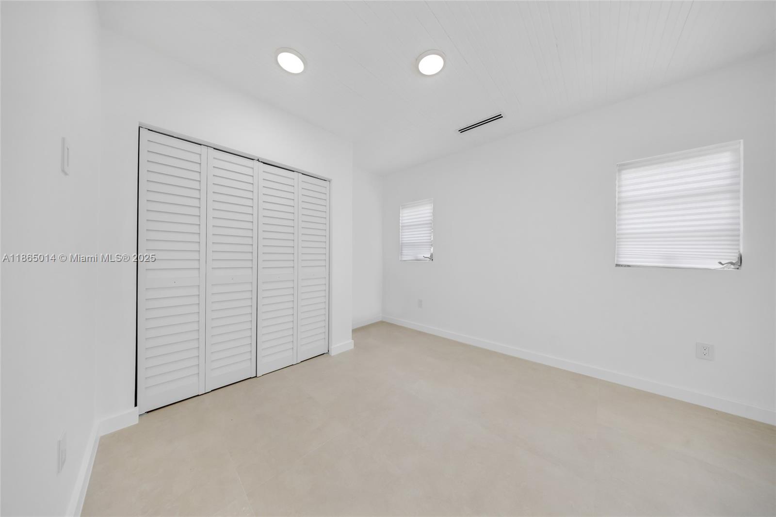 275 Northwest 97th Street Miami, FL 33150 - Photo 18 of 26 an empty room with windows
