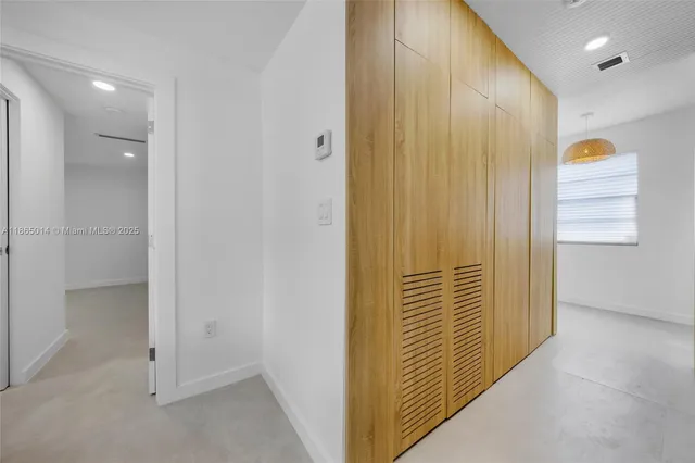 a view of hallway with shower