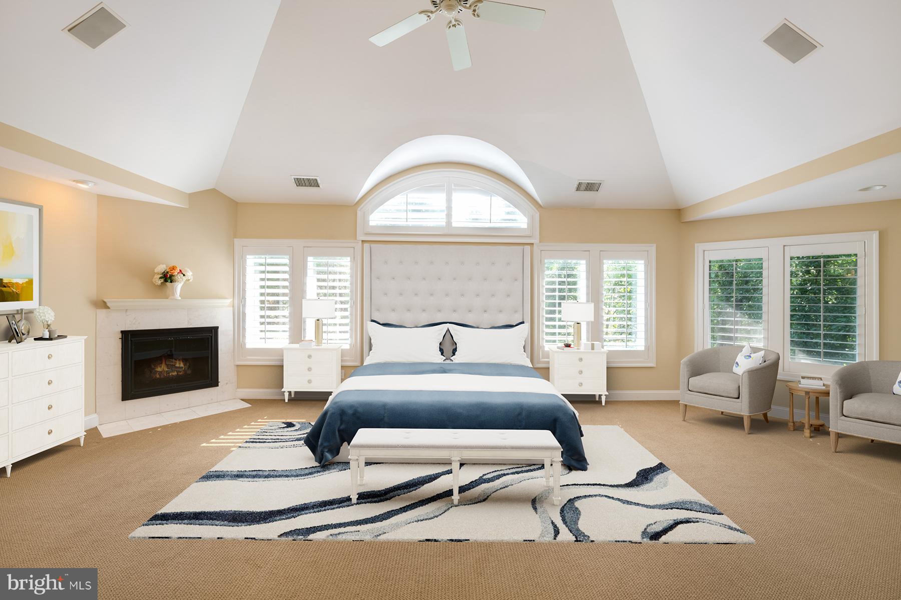 1202 Marinaview Drive Arnold, MD 21012 - Photo 13 of 26 a spacious bedroom with a bed and a fireplace