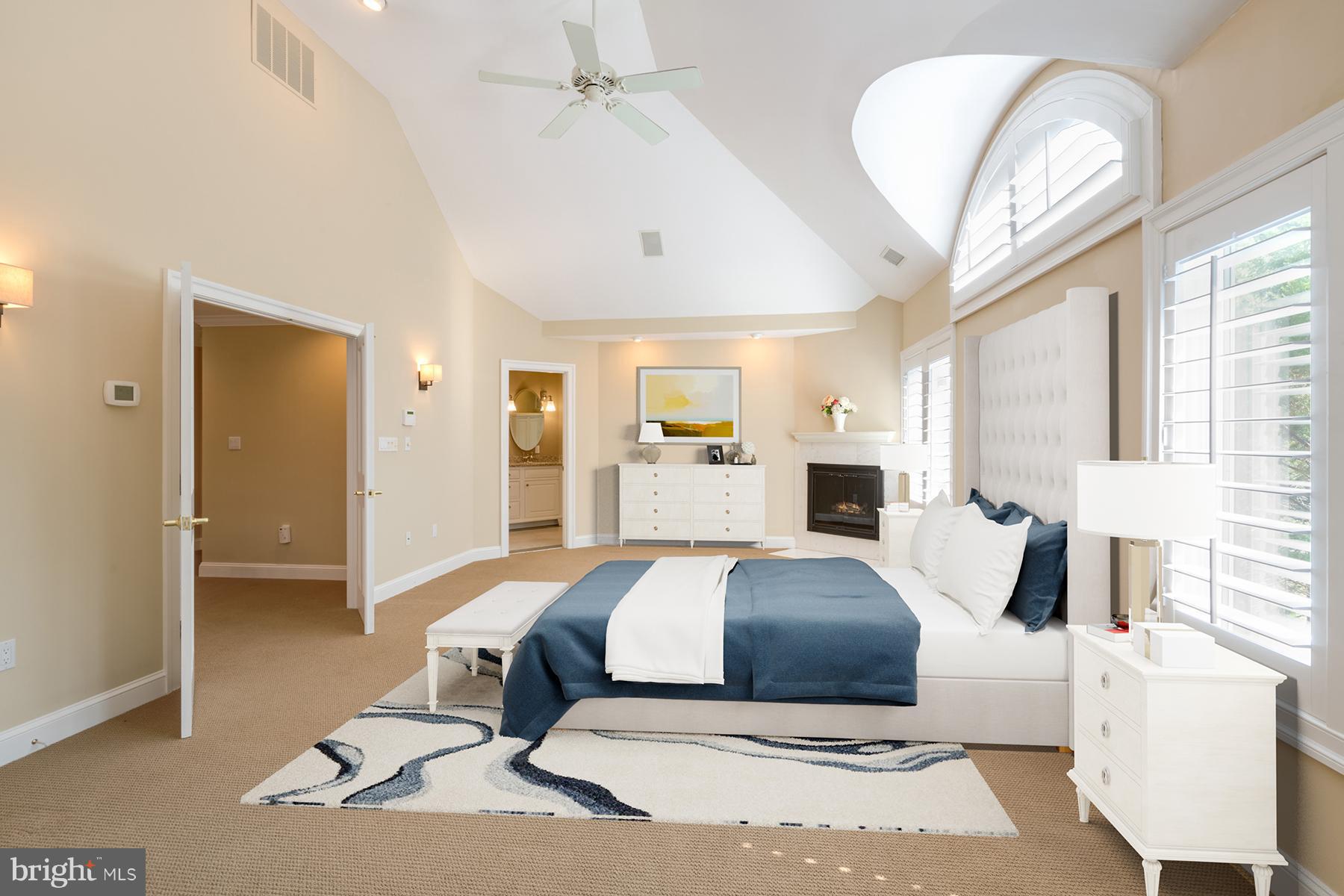 1202 Marinaview Drive Arnold, MD 21012 - Photo 14 of 26 a bedroom with a large bed and a chandelier