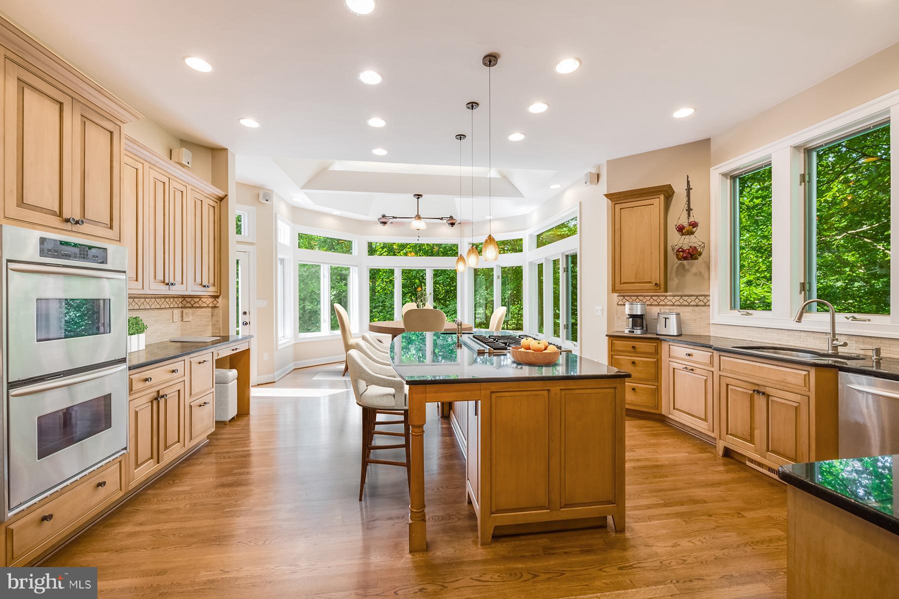 1202 Marinaview Drive Arnold, MD 21012 - Photo 7 of 26 a kitchen with stainless steel appliances granite countertop a stove and a large window