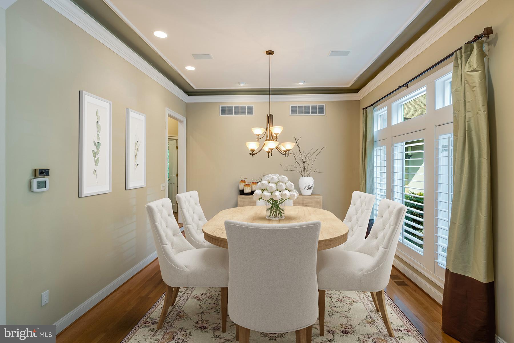 1202 Marinaview Drive Arnold, MD 21012 - Photo 10 of 26 a dining room with furniture a chandelier and wooden floor