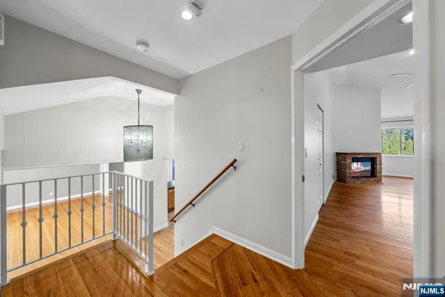 a view of balcony with wooden floor and seating space