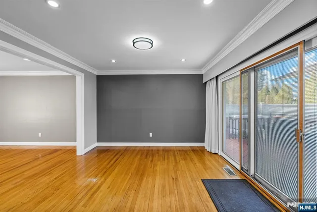 a kitchen with stainless steel appliances granite countertop a refrigerator a stove a sink dishwasher with a dining table and chairs