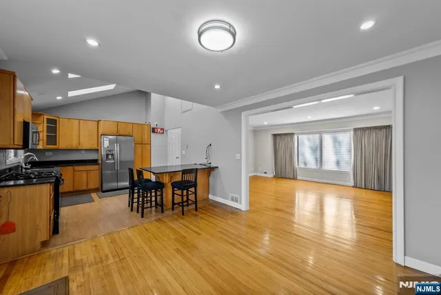 a view of an empty room and a window