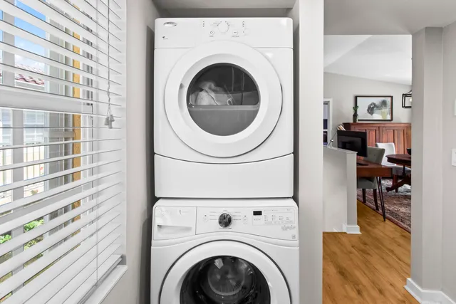 an aerial view of lake and residential houses with outdoor space