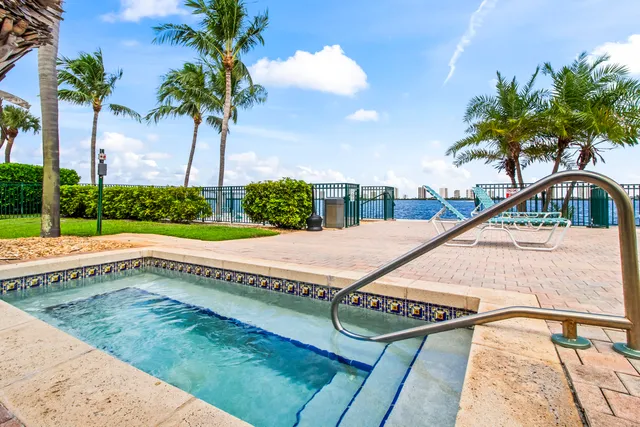 a view of a backyard with swimming pool