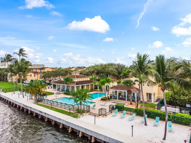 a view of a lake with a bench in the background