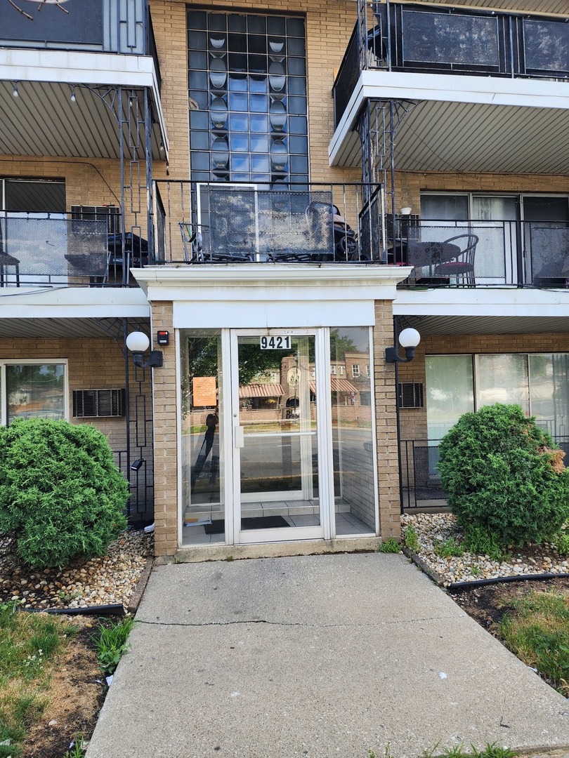 9421 South Roberts Road, Unit 1NW Hickory Hills, IL 60457 - Photo 1 of 12 front view of a building