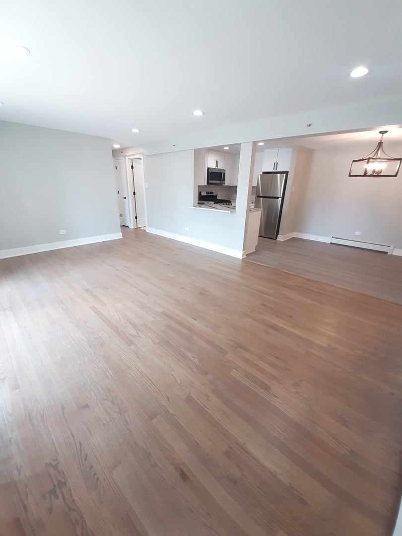 9421 South Roberts Road, Unit 1NW Hickory Hills, IL 60457 - Photo 6 of 12 an empty room with furniture and fire place