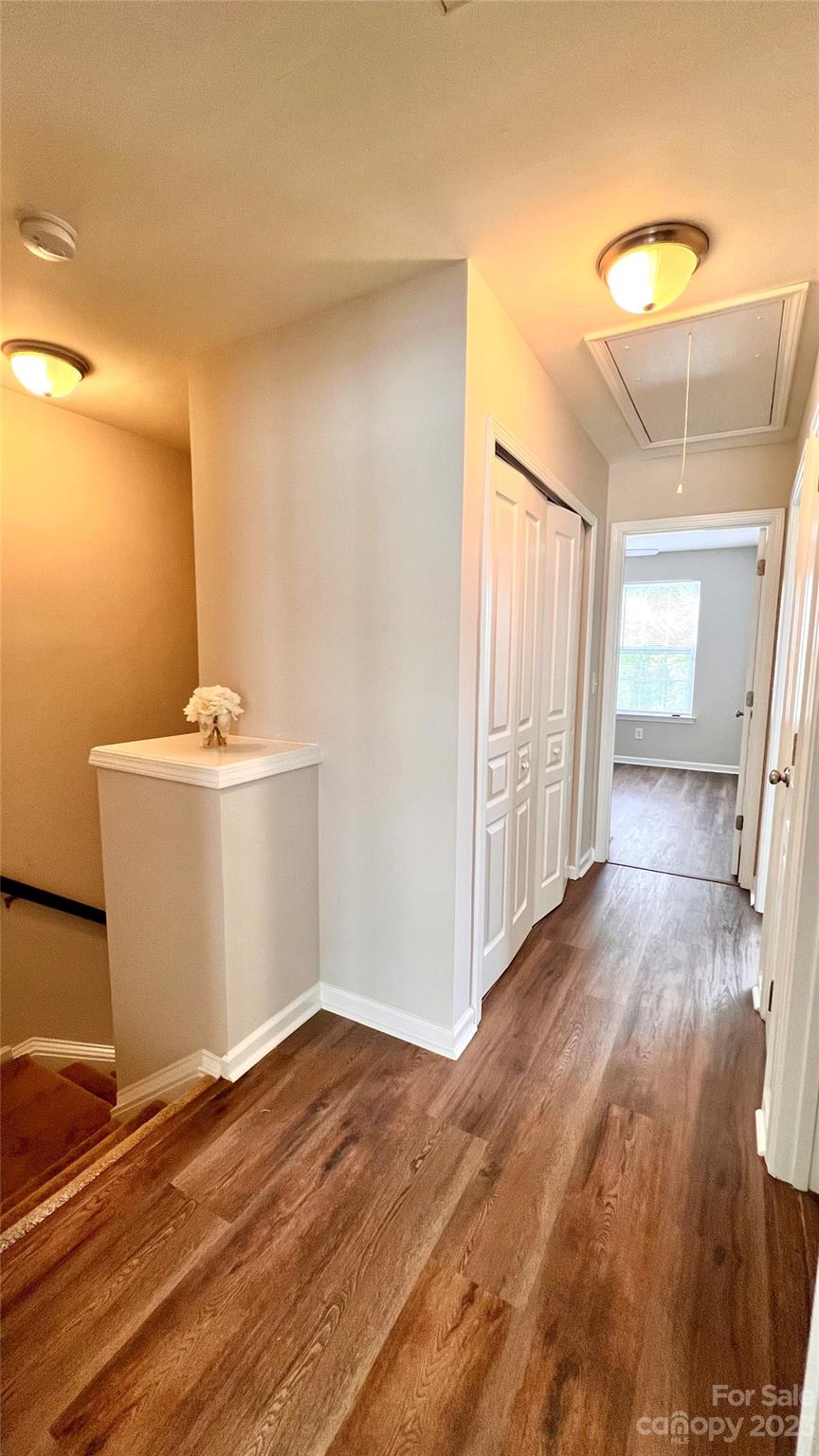 637 Brickdust Court Fort Mill, SC 29708 - Photo 11 of 18 a view of a room with wooden floor and white walls