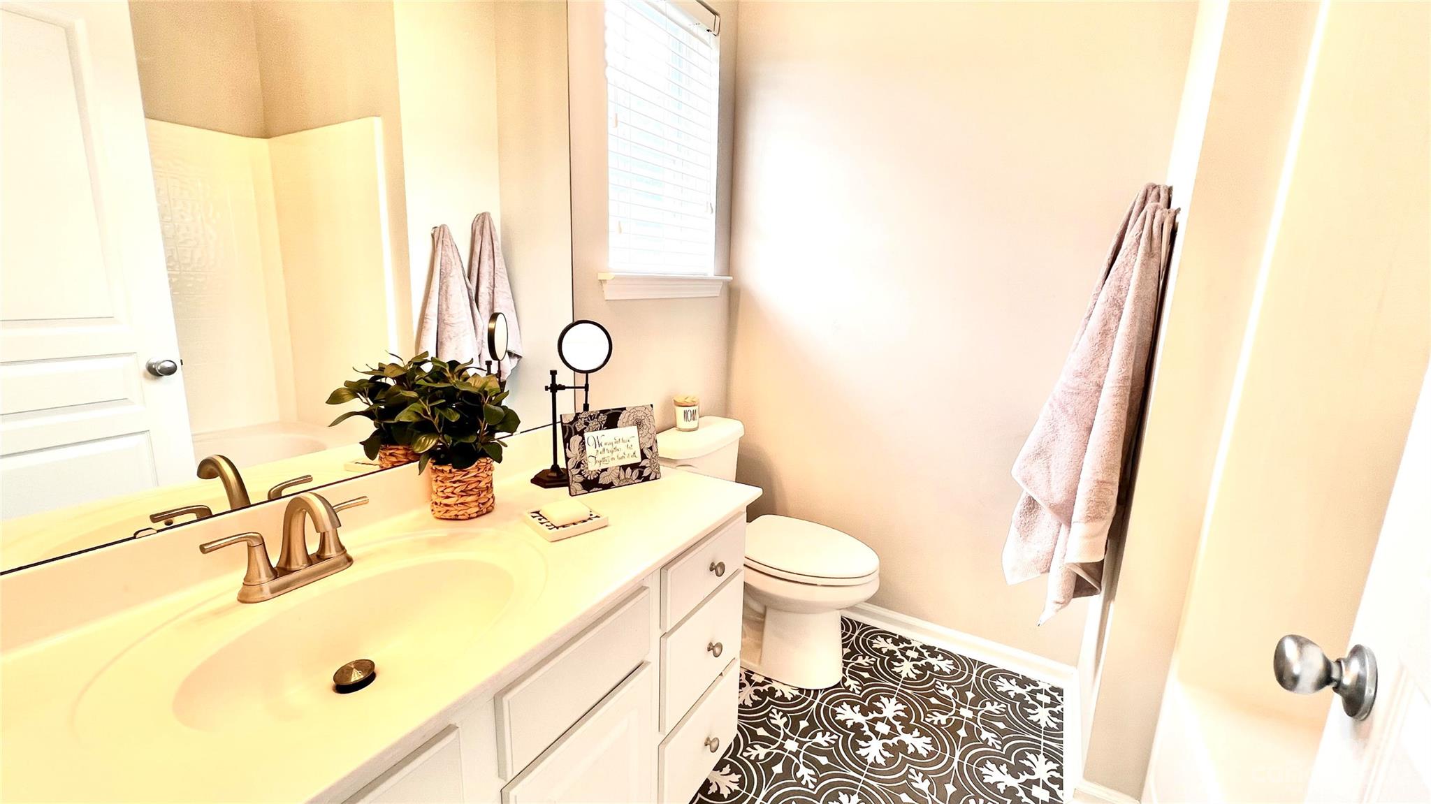 637 Brickdust Court Fort Mill, SC 29708 - Photo 13 of 18 a bathroom with a sink and a mirror