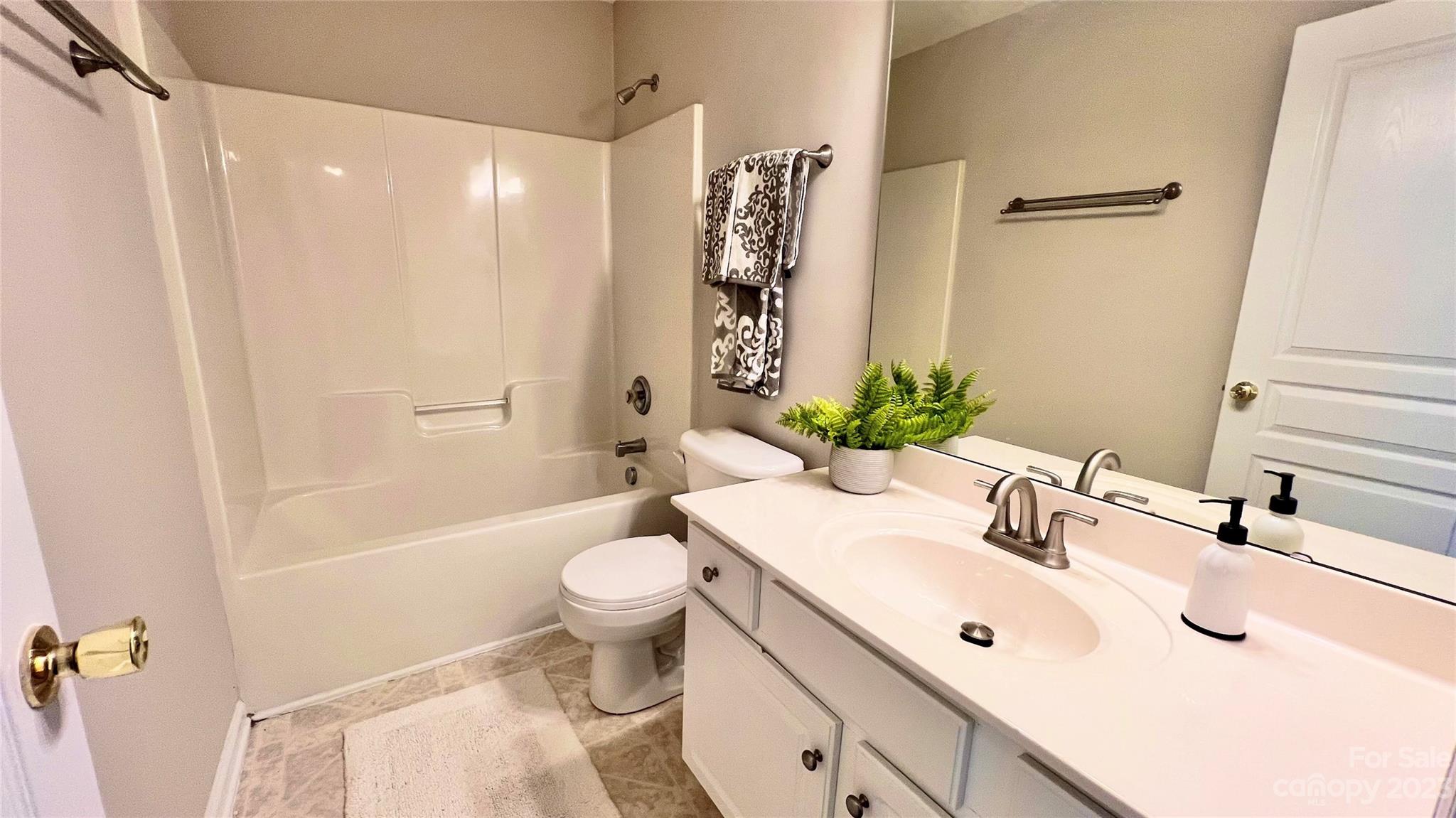 637 Brickdust Court Fort Mill, SC 29708 - Photo 17 of 18 a bathroom with a sink toilet a shower and a mirror