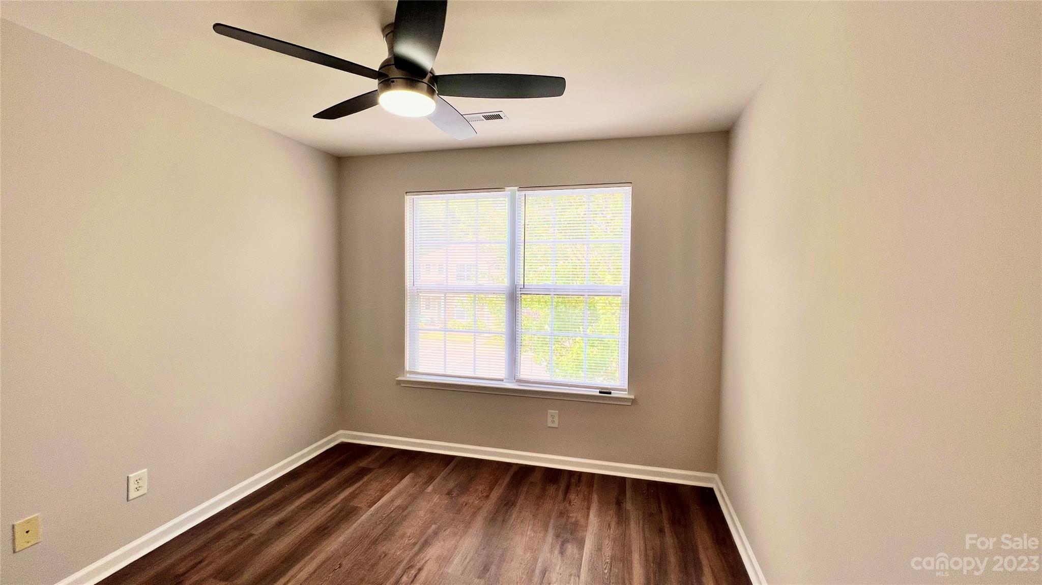 637 Brickdust Court Fort Mill, SC 29708 - Photo 18 of 18 an empty room with a window and a fan