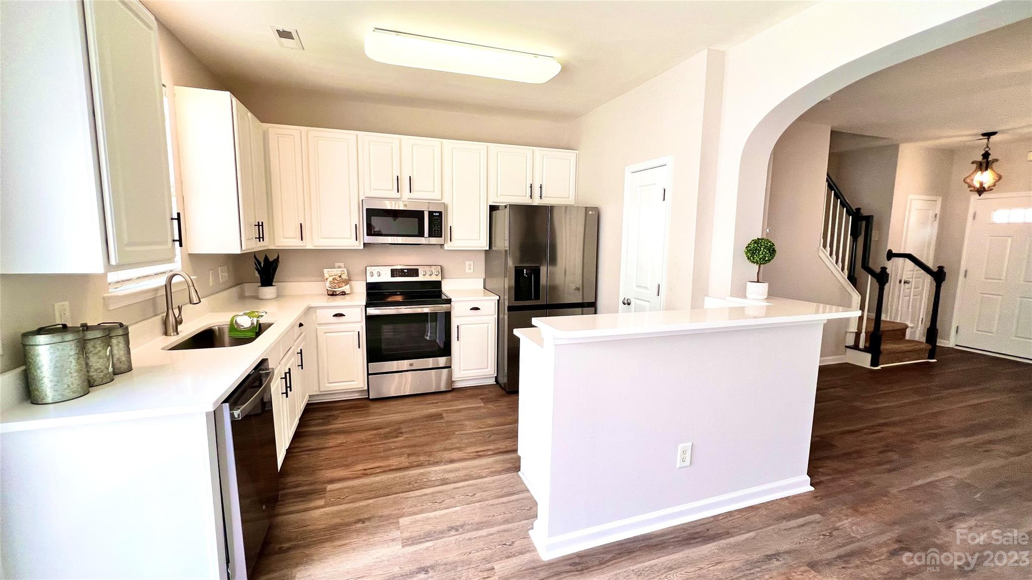 637 Brickdust Court Fort Mill, SC 29708 - Photo 2 of 18 a kitchen with kitchen island a counter top space a sink stainless steel appliances and cabinets