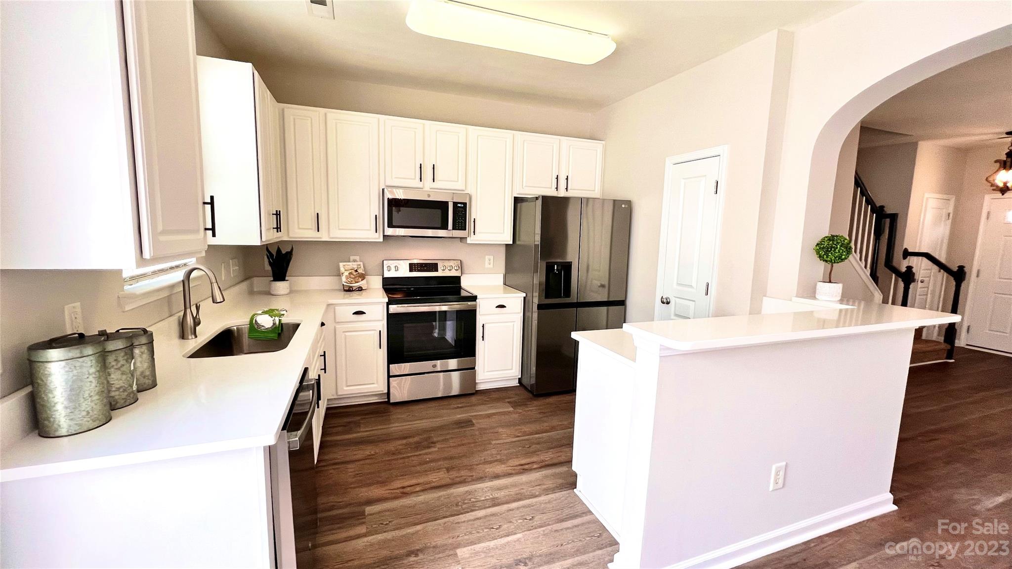 637 Brickdust Court Fort Mill, SC 29708 - Photo 4 of 18 a kitchen with kitchen island a sink appliances and cabinets