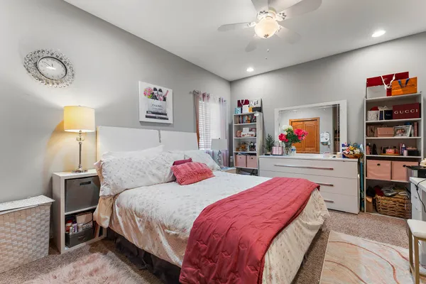 a bedroom with a bed and dresser