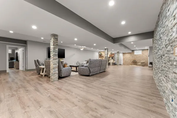 a view of a room with gym equipment and refrigerator