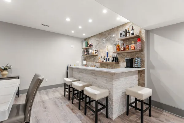 a bedroom with a bed and a couch