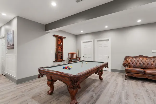 wooden floor in an empty room with a fireplace