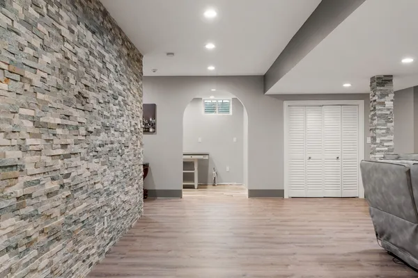 a view of a livingroom with furniture and a flat screen tv
