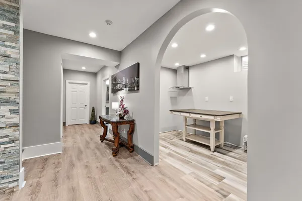 a view of a hallway with wooden floor