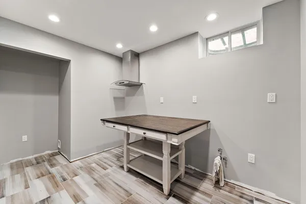 a bedroom with a bed and a couch