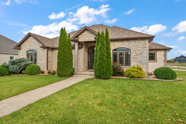 an aerial view of a house with a swimming pool