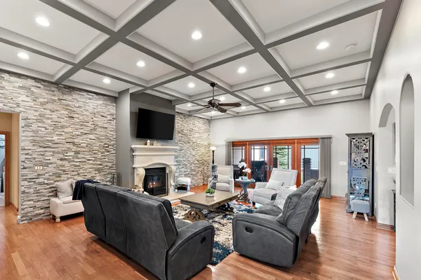 a living room with fireplace furniture and a flat screen tv