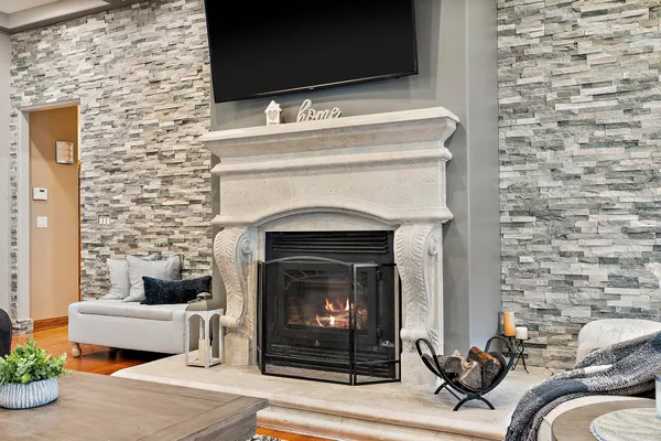 a living room with furniture and a fireplace