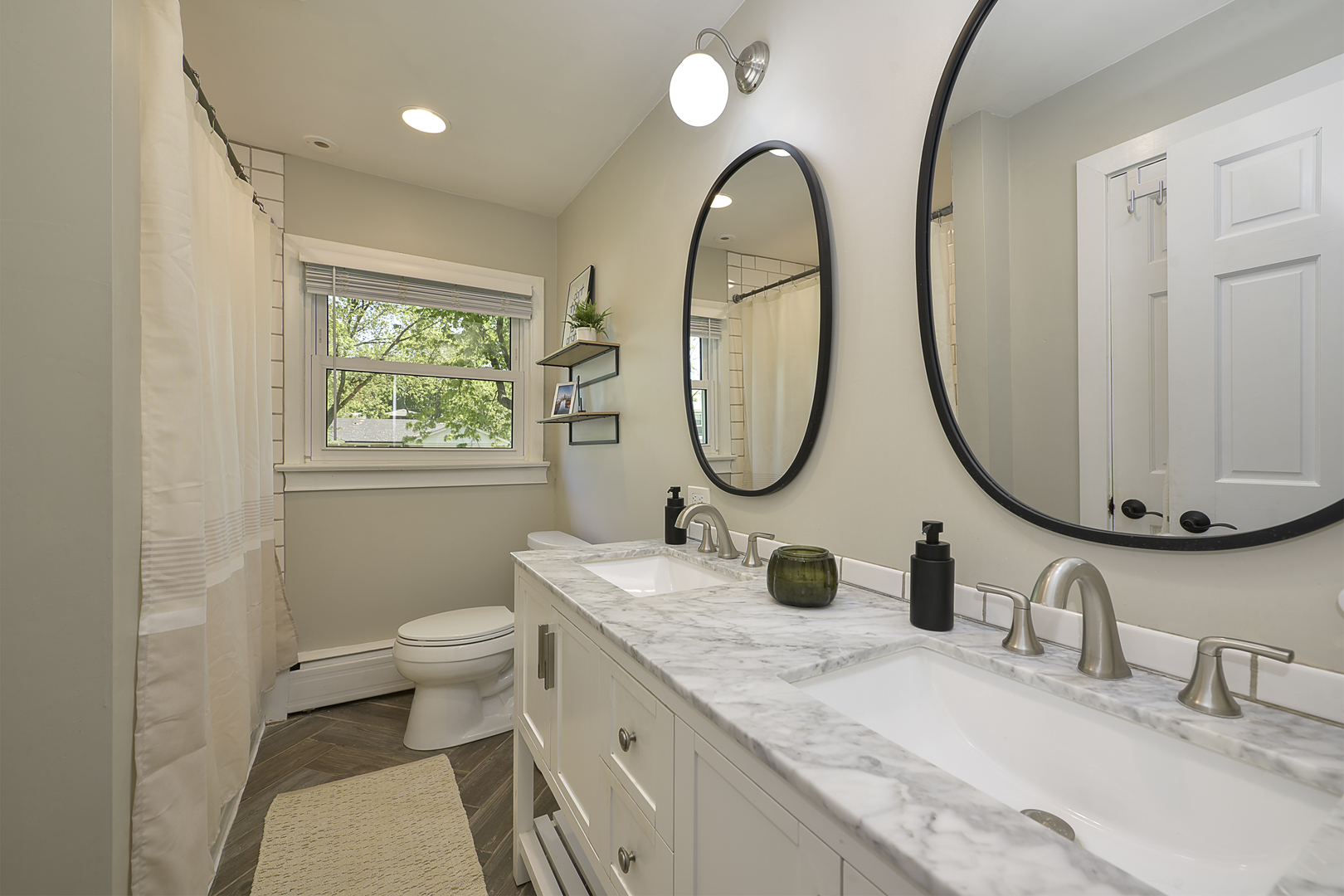 256 Sharon Drive Barrington, IL 60010 - Photo 16 of 23 a bathroom with a granite countertop toilet a sink a mirror and a window