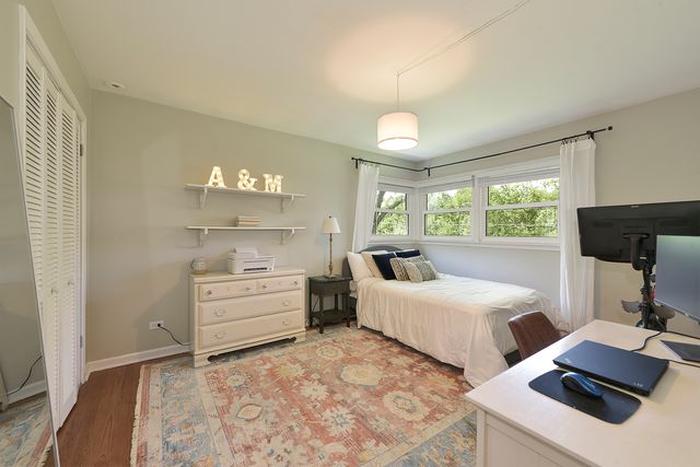 a room with two beds and a window