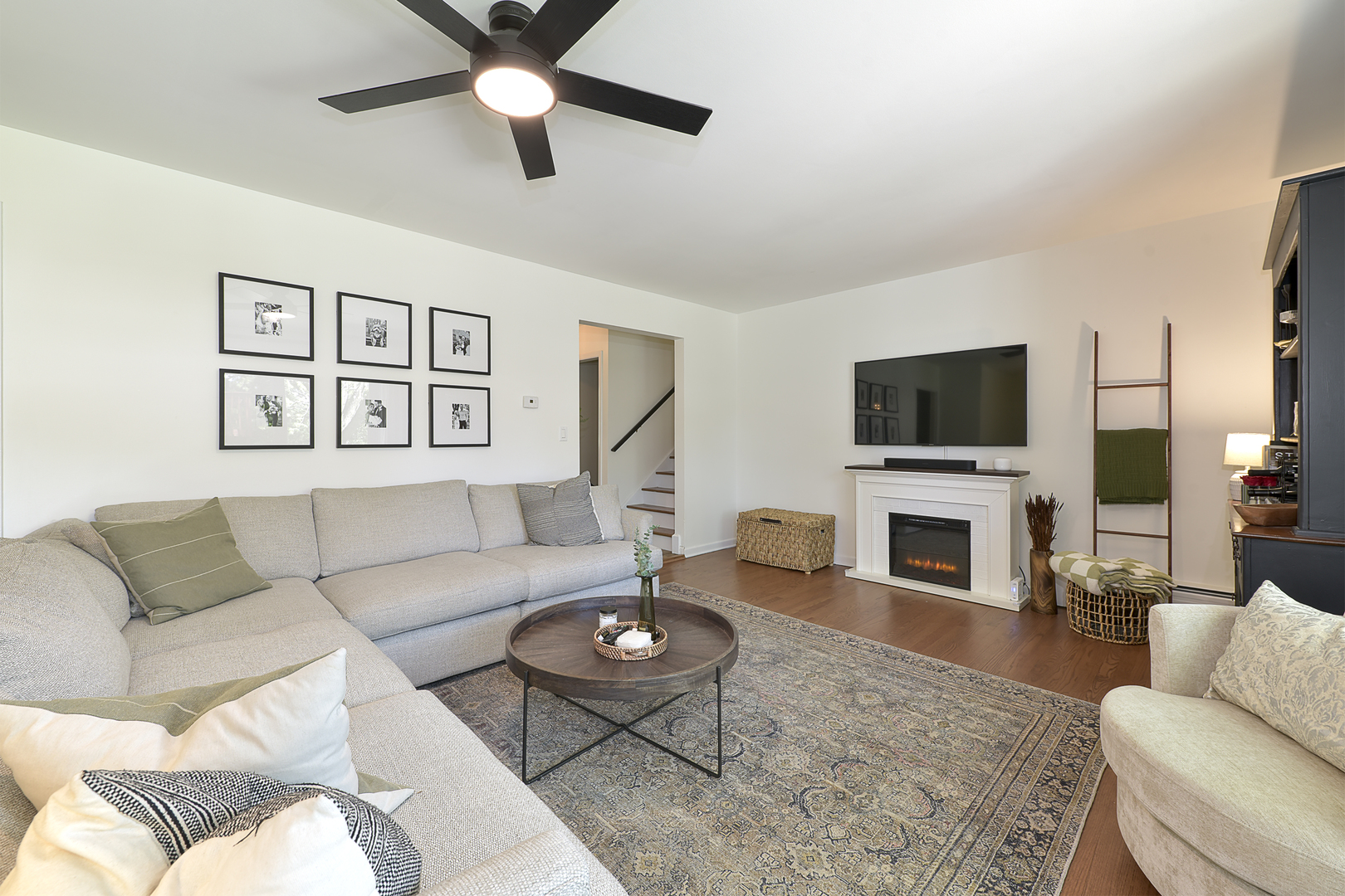 256 Sharon Drive Barrington, IL 60010 - Photo 5 of 23 a living room with furniture a fireplace and a flat screen tv