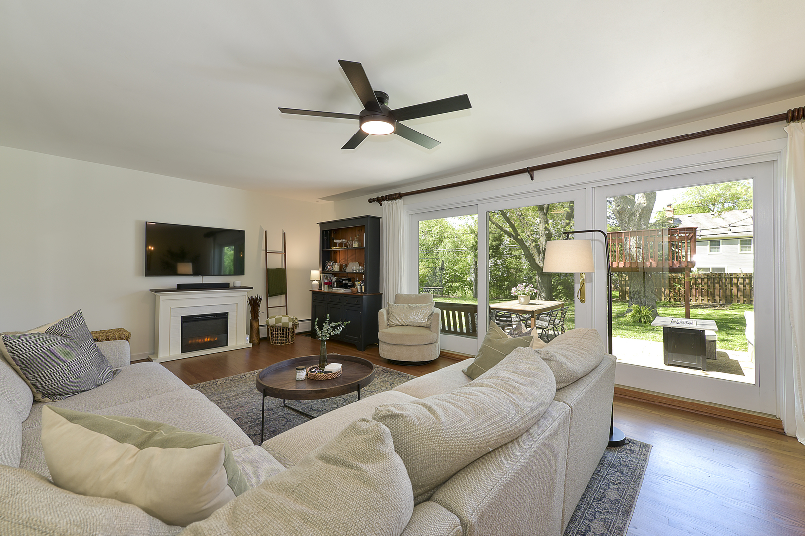 256 Sharon Drive Barrington, IL 60010 - Photo 6 of 23 a living room with furniture a flat screen tv and a fireplace