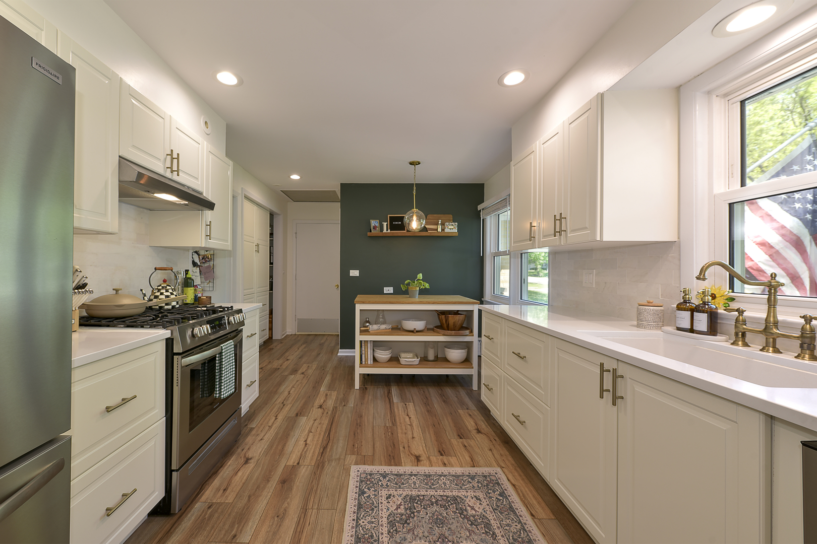 256 Sharon Drive Barrington, IL 60010 - Photo 9 of 23 a large white kitchen with stainless steel appliances granite countertop a stove a sink dishwasher and cabinets with wooden floor
