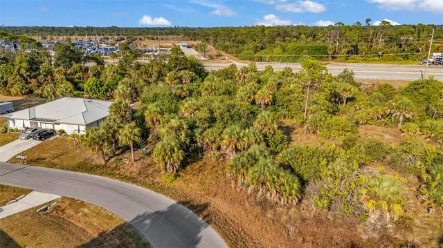 a view of a room with wooden floor and lake view